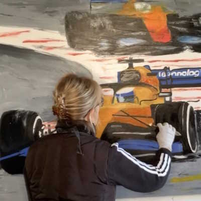 Abstract Motorsport Artist anita Lewis work on a dueling McLaren painting  
