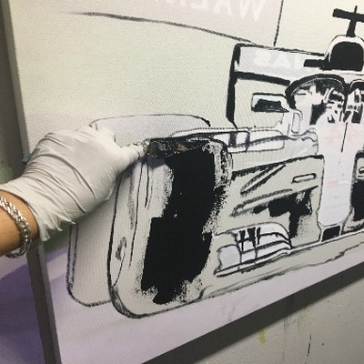 Anita Lewis working on an Abstract Motorsport painting.